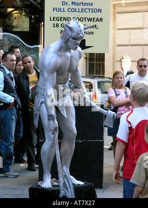 Street theatre attracts large crowds at Covent Garden London GB UK EU Stock Photo