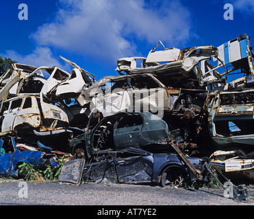 Wrecked cars piled up in scrapyard, Guadeloupe, French West Indies Stock Photo