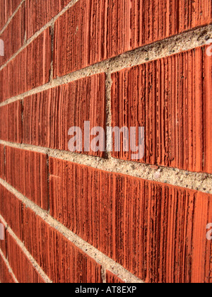 row of red pointed bricks on the gable wall of a house running off into the distance Stock Photo