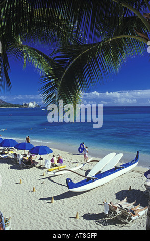 Waikiki beach with outrigger canoe, Island of Oahu Stock Photo