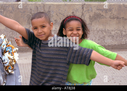 Black siblings age 9 and 7 celebrating at Cinco de Mayo Festival. St Paul Minnesota USA Stock Photo