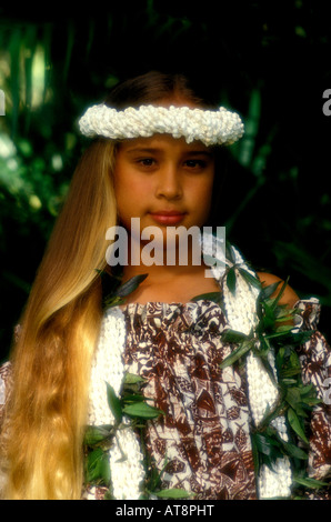 Portrait of a beautiful, young 'hapa' (part Hawaiian) girl wearing a lei and haku lei of multiple strands of small white shells. Stock Photo