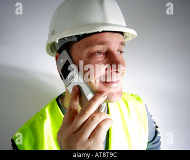 Construction worker on a mobile phone Stock Photo