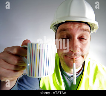 Typical construction worker at break time Stock Photo