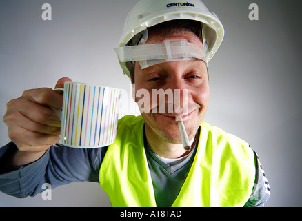 Typical construction worker at break time Stock Photo