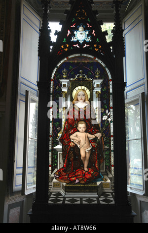 'Madonna Enthroned', stained glass artwork by Giuseppe Bertini in a neo-Gothic frame in a Vatican Museums' window bay Stock Photo