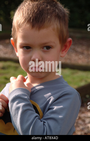 Little boy looking unhappy Stock Photo