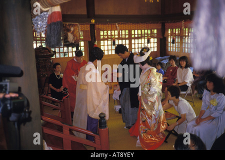 Shinto Buddist temple and preist at a traditional wedding ceremony Stock Photo