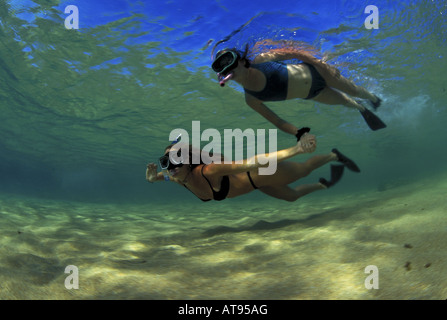 Mother & daughter snorkeling, Haena, Kauai Stock Photo