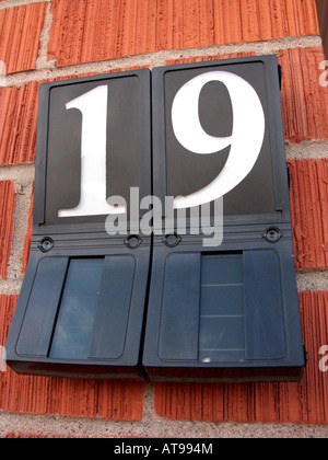 solar powered house number 19 on red brick house outside Belfast Stock Photo