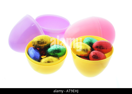 Plastic Egg Shells and Chocolate Easter Eggs in Bowl Stock Photo