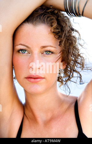 Serious young adult Caucasian female looking at viewer Stock Photo