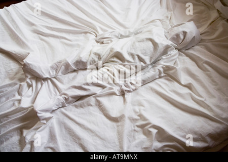 Body in the bed Children at play Stock Photo