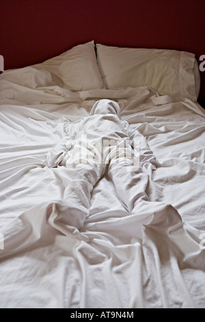 Body in the bed Children at play Stock Photo