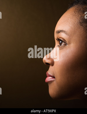 Close up profile portrait of serious African American young adult female Stock Photo