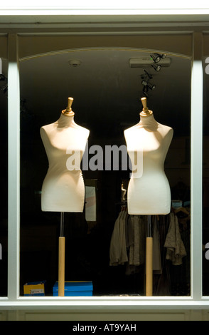 Two unclothed tailors dummies in a shop window Stock Photo