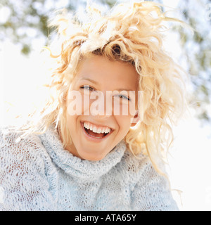 Attractive young blond woman smiling and laughing in Maui Hawaii Stock Photo