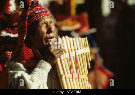 Native Quechua indian playing the panpipes in Cuzco, Peru Stock Photo ...