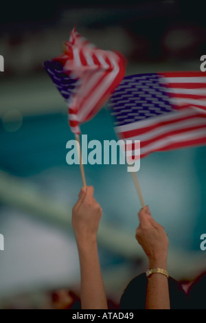 Hands waving American flags Stock Photo