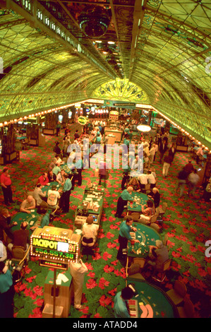 Aerial view of the gaming floor inside a casino in Las Vegas Nevada Players are sitting at tables dealers are dealing games Stock Photo