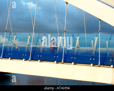 Pedestrian on the Lowry Bridge over the Manchester Ship Canal, Salford Quays, UK Stock Photo