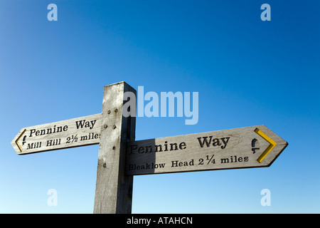 Wooden Pennine Way sign post on Bleaklow in the Peak District pointing left to Mill Hill and right to Bleaklow Stock Photo