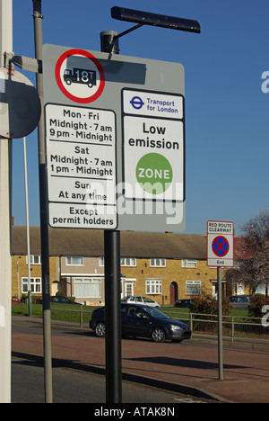 Vehicle restriction road signs adapted to include low emission zone boundary homes beyond Stock Photo