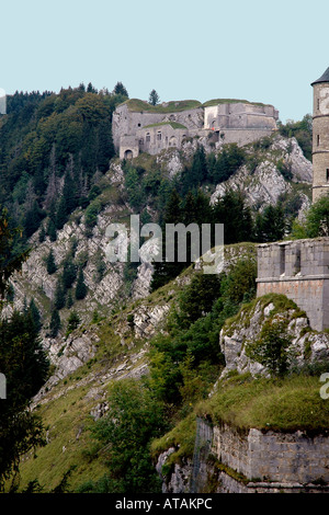 Part of the ruined Château de Joux on a high escarpment overlooking Pontarlier in France's Jura region Stock Photo