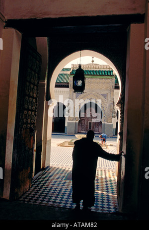 Moroccan man, courtyard, place of worship, house of worship, religious building, Kairaouine Mosque, Fes el-Bali, city of Fez, Morocco, North Africa Stock Photo