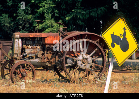 Tractor and tractor crossing road sign Ukiah Mendocino County California Stock Photo