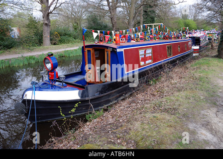 Narrowboat canal boat covered in a variety of colourful paraffin lamps at the Woking canal festival 2007 Basingstoke canal Stock Photo