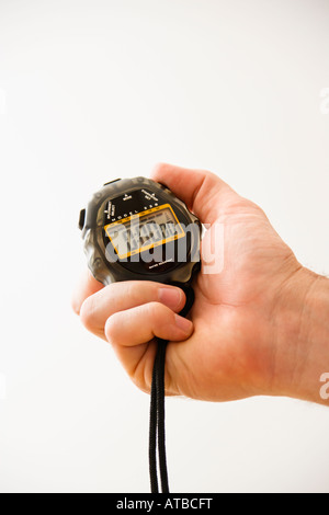 Close up of adult male hand holding stopwatch Stock Photo