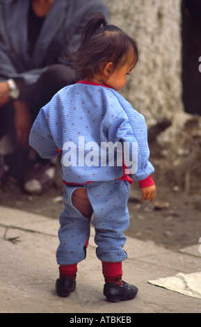 Chinese girl with back flap in pants. Kunming, Yunnan, China Stock Photo