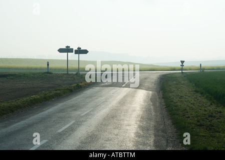 Forked road in countryside Stock Photo