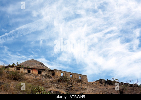 Old stone houses built into the mountains of Porto Santo Stock Photo