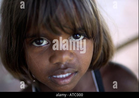 A young aboriginal girl in the Manyalluluk outback community near Pine Creek in the Northern Territory of Australia Stock Photo