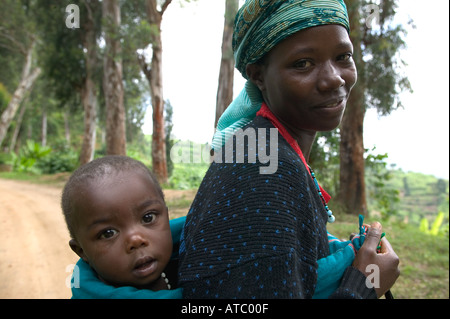 A Rwandan baby is carried on her mother s back near Lake Kivu in Rwanda ...
