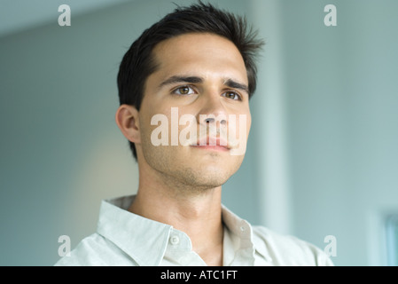 Young man looking away, portrait Stock Photo