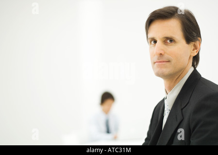 Businessman smiling at camera, portrait Stock Photo