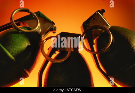 Three hand grenades posing menacingly. Stock Photo
