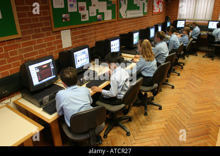 Mixed junior class in Computer room at independent school Stock Photo
