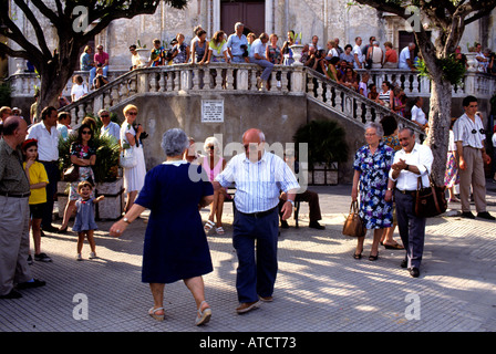 Taromina Sicily Italy  town city tourist medieval scenic old people dancing Stock Photo