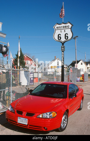 Red Hire Car by Route 66 road sign, Springfield, Illinois, USA Stock Photo