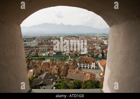 View from tower window in Castle or Schloss Thun of the city of Thun Switzerland the Alps and the River Aare Stock Photo