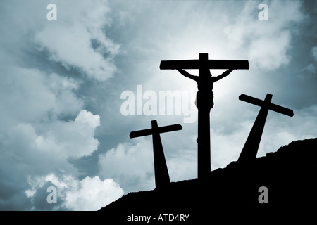 Jesus Christ crucified in Golgotha ///crucifixion Easter crucifix Calvary passion backlit silhouette cross religion god Christianity clouds storm sky Stock Photo