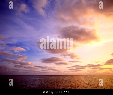 Clouds in a sunset sky over the ocean Stock Photo