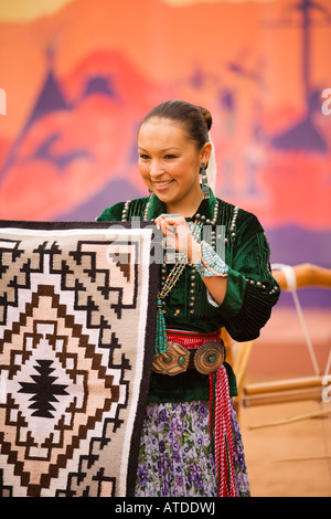 Navajo Indian woman displays a Navajo rug Gallup Inter Tribal Indian Ceremonial Gallup New Mexico Stock Photo