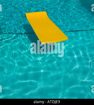 Yellow float in swimming pool Stock Photo