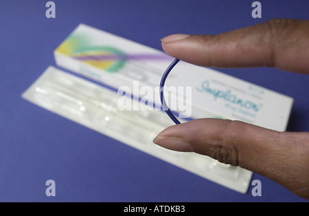 Implanon contraceptive implant removal - Stock Image - C011/7408