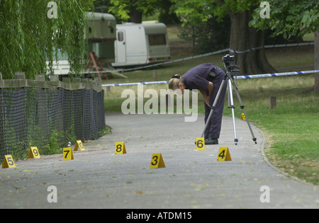 Scene of crime team examines the evidence UK Stock Photo